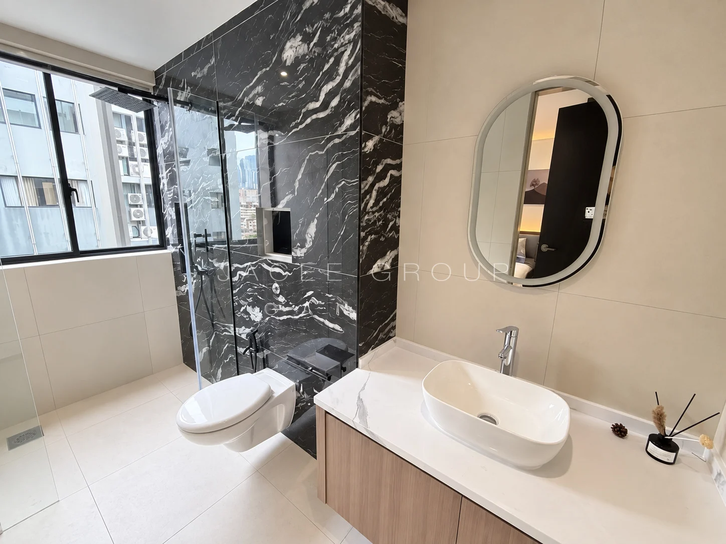 Bathroom with Oval Mirror at the Katana II triplex penthouse in Ampang Hilir