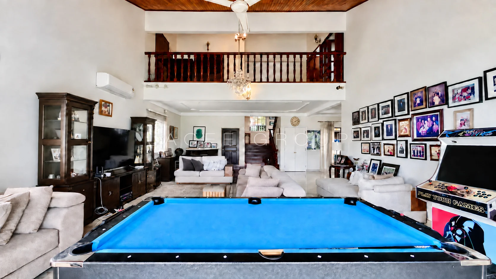 Double Height Living and Pool Table at the Bangsar bungalow with large garden