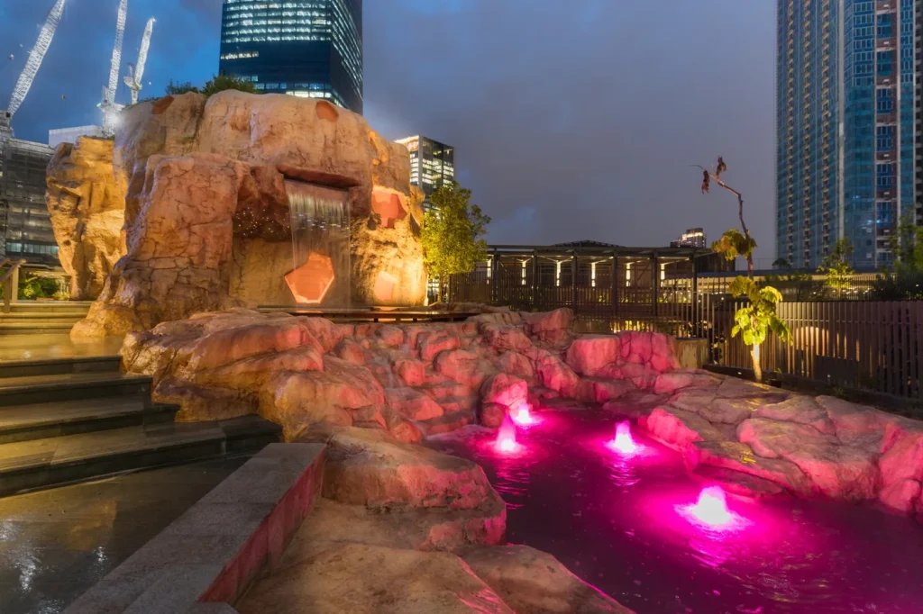 Illuminated Play Cave and water feature at TRX City Park